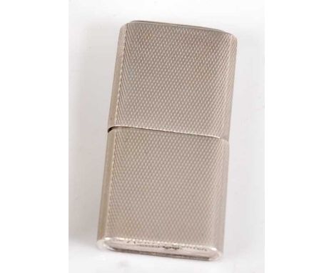 A late Art Deco silver pocket cigarette lighter titled 'The Howitt', having engine turned decoration, with removable cover, m