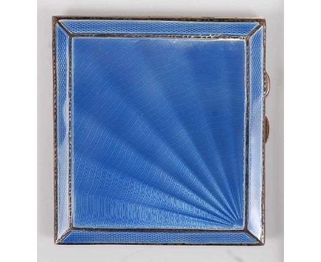 An Art Deco silver and blue guilloche enamel decorated hinged pocket cigarette case, having engine turned back cover and gilt