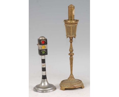 An Art Deco chrome novelty table lighter modelled as a traffic light column, with hinged cover, raised on circular outswept f