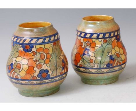 Charlotte Rhead for Crown Ducal - a pair of 1930s pottery squat vases, each of gourd form, bright colour stylise floral and t