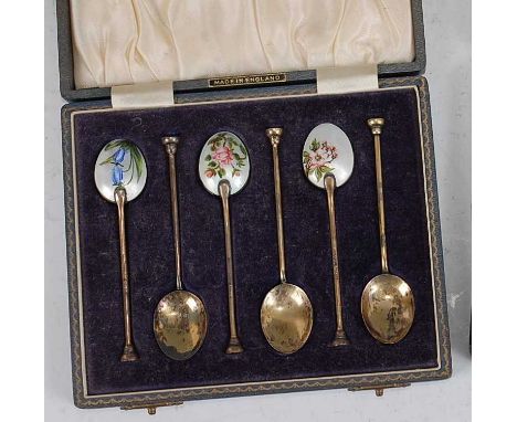 A set of six 1960s silver gilt and enamel decorated coffee spoons, the bowls enamel decorated with floral sprays, having step