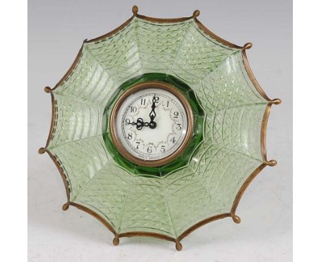 A novelty green pressed glass and brass mounted 'umbrella' bedside clock, having winding movement, the white enamel floral di
