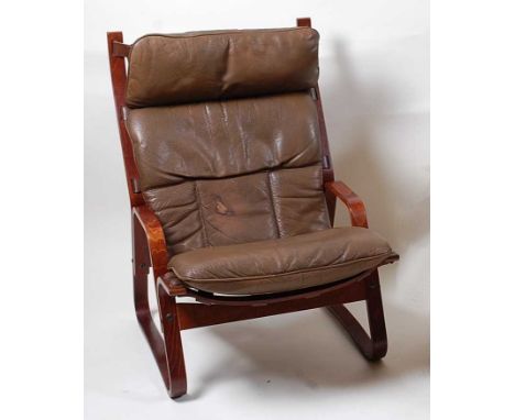 A 1960s Danish formed laminate framed open armchair, having a canvas slung seat with tan leather removable cushion, of Allen 