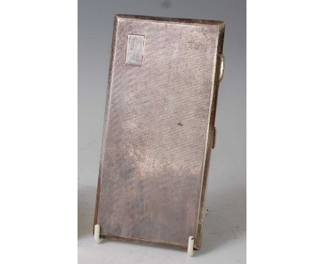 A large late Art Deco silver pocket cigarette case, having all-over engine turned exterior with small raised panel initialled
