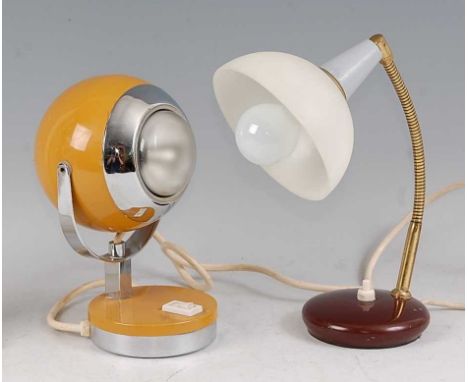 A 1960s chrome and enamel painted squat globe table lamp, the hinge shade raised on U shaped arm with on/off switch to base, 