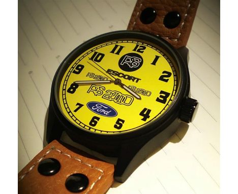 Classic yellow face having Arabic numerals, sweep seconds hand &amp; Ford motif &amp; imagery, all before the Quartz movement