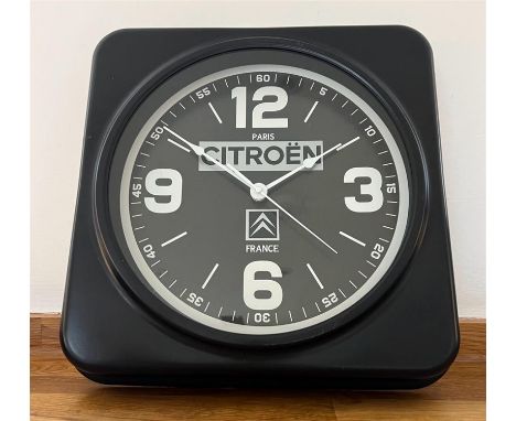 Black ground face with 'Citroën Paris France' and emblem upon, Arabic numerals at the cardinal points and sweep seconds hand.