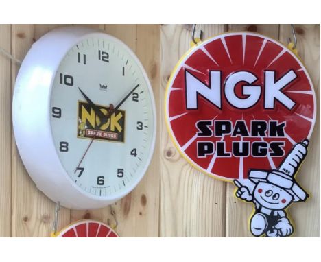 A rare and original automotive advertising wall clock in fine working order.Having electrified 240v movement. White face with