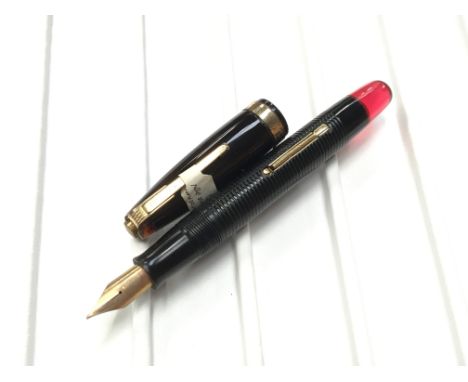 A rare Watermans 100 Years fountain pen with a red sectioned barrel and original 100 years 14ct gold nib. Condition Report Ca