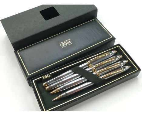 A 4 piece Cross Townsend fountain pen, roller ball, ball pen and pencil set in a chrome and gold coloured design with the fou