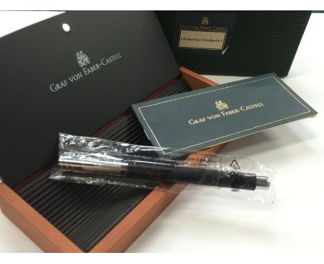 A Graf Von Faber Castell roller ball pen with chrome and brushed matte black design presented in its original wood Faber Cast