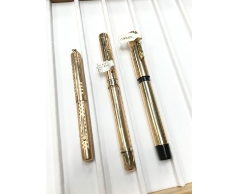A rolled gold Mabie Todd Swan leverless fountain pen together with a gold coloured Camel button filler and another roller gol