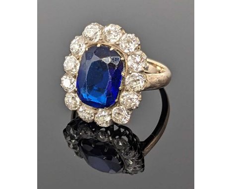 N.B.AMENDED: BLUE PASTE &amp; DIAMOND CLUSTER RING, surrounded by thirteen diamonds, 0.10ct each approx., ring size K 1/2, 5.