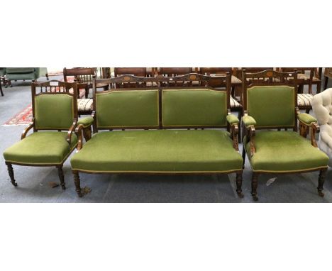 A Edwardian Inlaid Mahogany Three Piece Salon Suite, comprising a sofa; together with an open armchair and a smaller chair