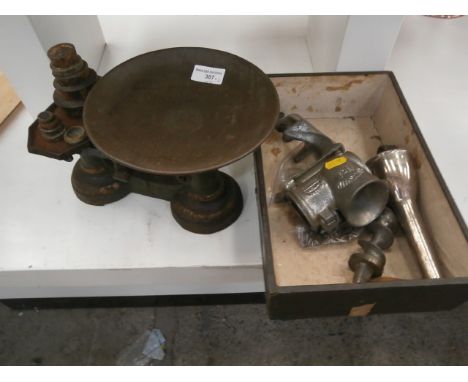 vintage scales with weights and a mincer