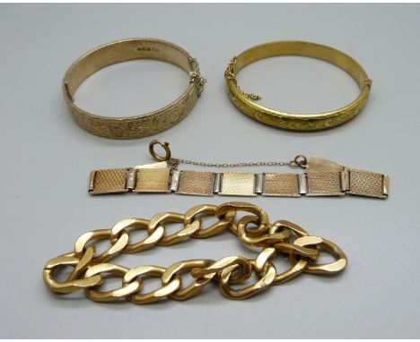 A silver gilt bangle and other gold tone jewellery 