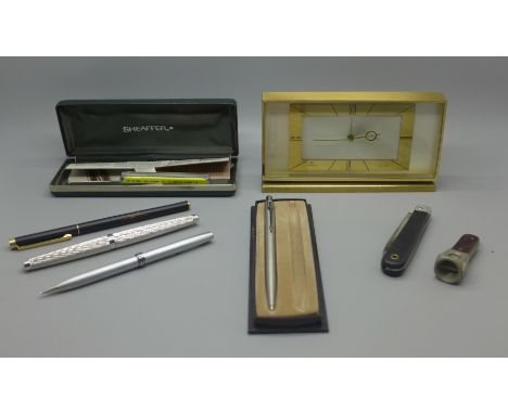 A Swiza 8-day brass mantel clock, a pocket knife, cigar cutter and ink pens including a Sheaffer with 14k gold nib 