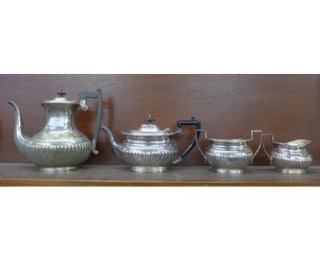 A three piece silver plated tea service with similar tea pot 