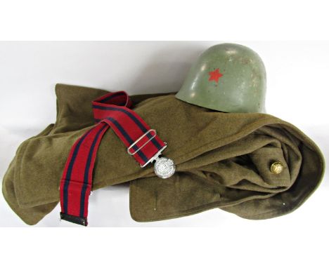 A Dutch Army khaki great coat circa 1950’s a Soviet style army helmet with red star emblem, and a military belt. 3 