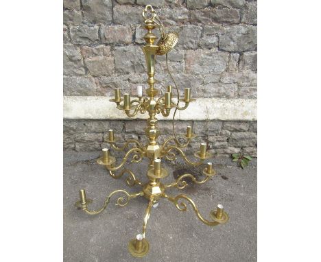 A good quality cast polished brass electrolier/hanging ceiling light with knopped stem and eighteen scrolling branches on thr