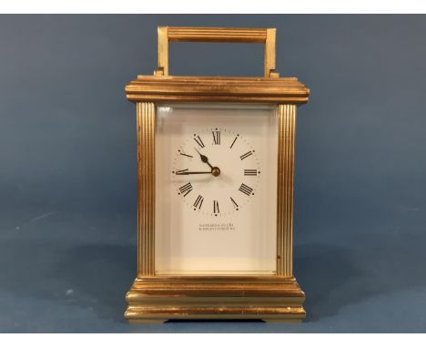 A Garrard &amp; Co carriage clock, the brass case with reeded column supports enclosing an eight day striking movement 