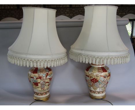 A pair of table lamps in the form of Japanese vases complete with&nbsp; shades 70 cm high approx.