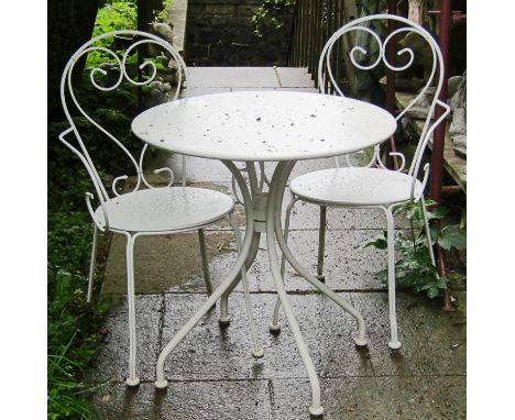 A cream painted light steel three piece garden terrace/bistro set comprising circular top table together with a pair of match