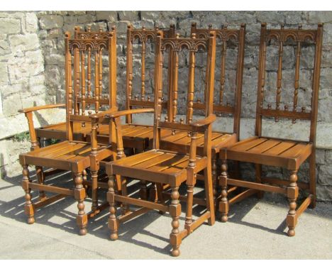 A set of six (4&amp;2) Ercol Colonial high back dining chairs with slatted seats raised on turned bobbin and block supports u