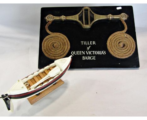 A wall plaque of the brass tiller of Queen Victoria’s  Barge and a model of the barge, 2. 