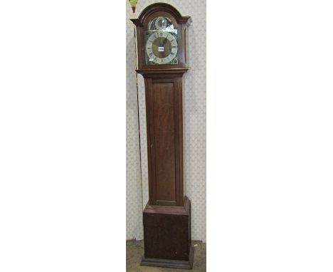 A mahogany Grandmother clock, the hood enclosing a broken arch brass dial with silvered chapter ring with Westminster, Winche