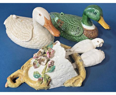 A mid 19th century wall bracket by Moore showing parrots above an open basket with applied floral detail together with two ce