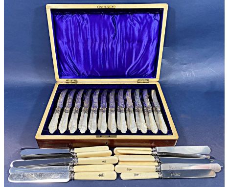 A mahogany cased set of early 20th century fruit knives and forks with mother of pearl handles for twelve settings and fiftee