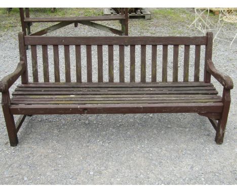 A vintage substantial stained hardwood garden bench with slatted seat and back, 180 cm long together with a further stained s