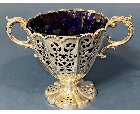 A Victorian pierced silver sugar basket with a glass liner, Sheffield 1857 by Henry Wilkinson, 12 cm high, 6.6 ozs approx 