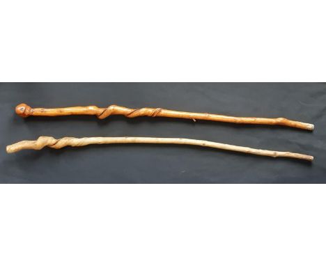 A walking stick of natural curly form and another similar, both 108cm approx. 