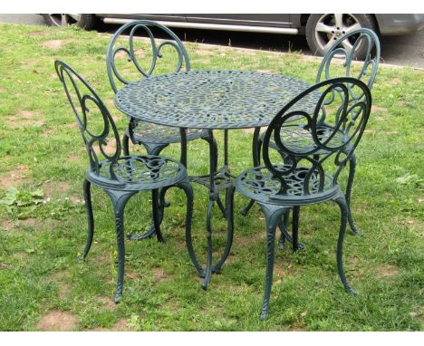 A contemporary green painted cast aluminium five piece garden terrace set comprising circular topped table and a set of four 