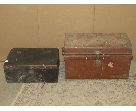 A small vintage tin trunk containing a quantity of old woodworking tools together with a further vintage portable pine tool c