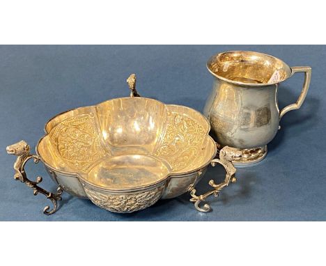 A silver embossed dish with mystical beast supports, London 1903 by Henry Wilkinson and a small silver tankard, 7.3 ozs appro