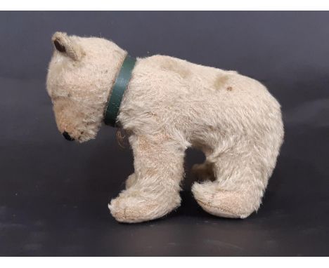 Steiff small polar bear circa 1950 with pin in ear, glass eyes (one missing), felt paw pads, stitched nose, mouth and claws, 