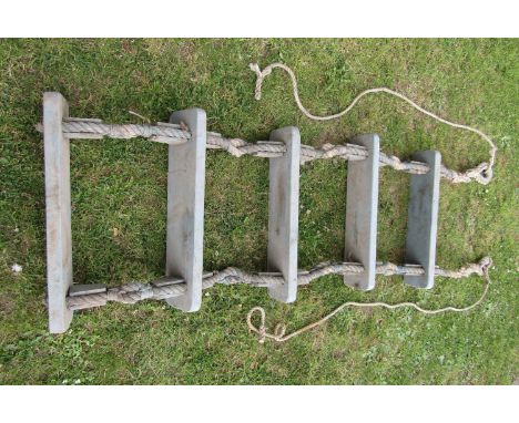 A marine rope ladder with five treads 