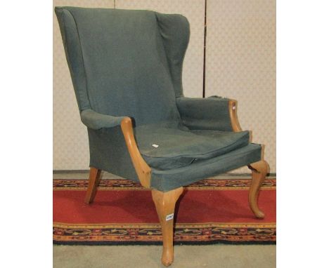 A vintage Parker Knoll wing armchair (for re-upholstery) model number 918/19 and a Victorian Carolean style chair in oak 
