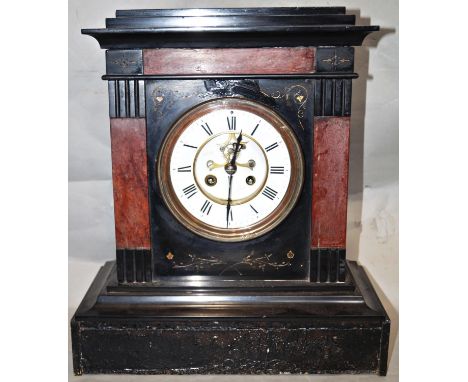 A substantial Victorian black slate and marble mantle clock with enamel dial and visible escapement, with eight day striking 