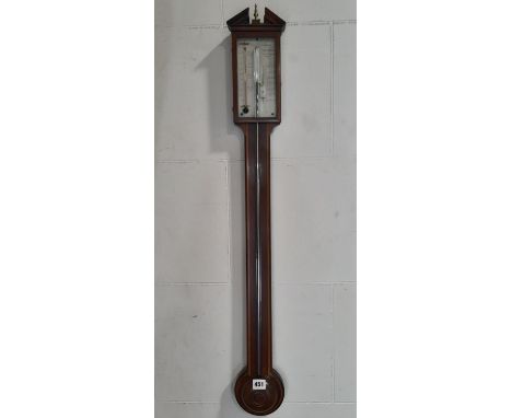 A Georgian walnut stick barometer with simple banded detail with silvered dial and engraved detail, by P. Barine of York 