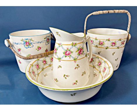 A collection of Minton china with repeating rosebud detail including two slop buckets, ewer and basin 