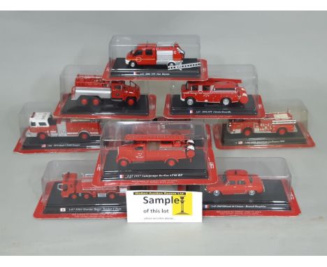 Collection of 1:64 scale mounted model fire service vehicles each displayed on a plinth with name of vehicle including 9 Del 