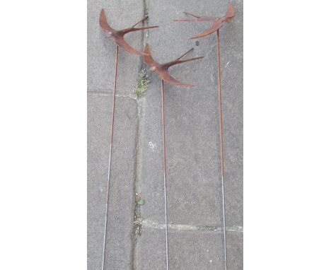 Three light steel decorative garden border stakes with swift finials 