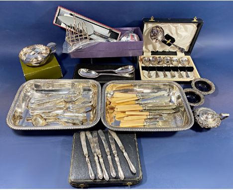 A Christofle silver plated bowl with loop handle and thumb rest, two tureen bases, a ladle and boxed sets of teaspoons and fr