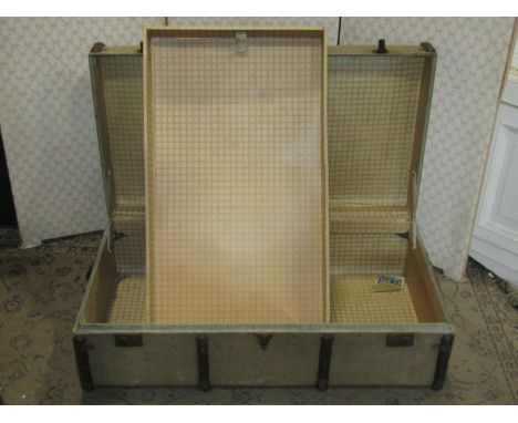 A vintage light green coloured fibre and timber banded cabin trunk initialled M W F 
