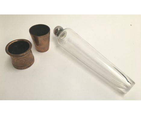 A conical glass Hunting Flask with metal hinged lid 21.5cm high together with a copper stirrup cup, half measure impressed to