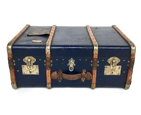 A vintage wooden steamer trunk by Bettini &amp; Fils, Montecarlo, with beech wood and metal bracing, vintage labels, and remo